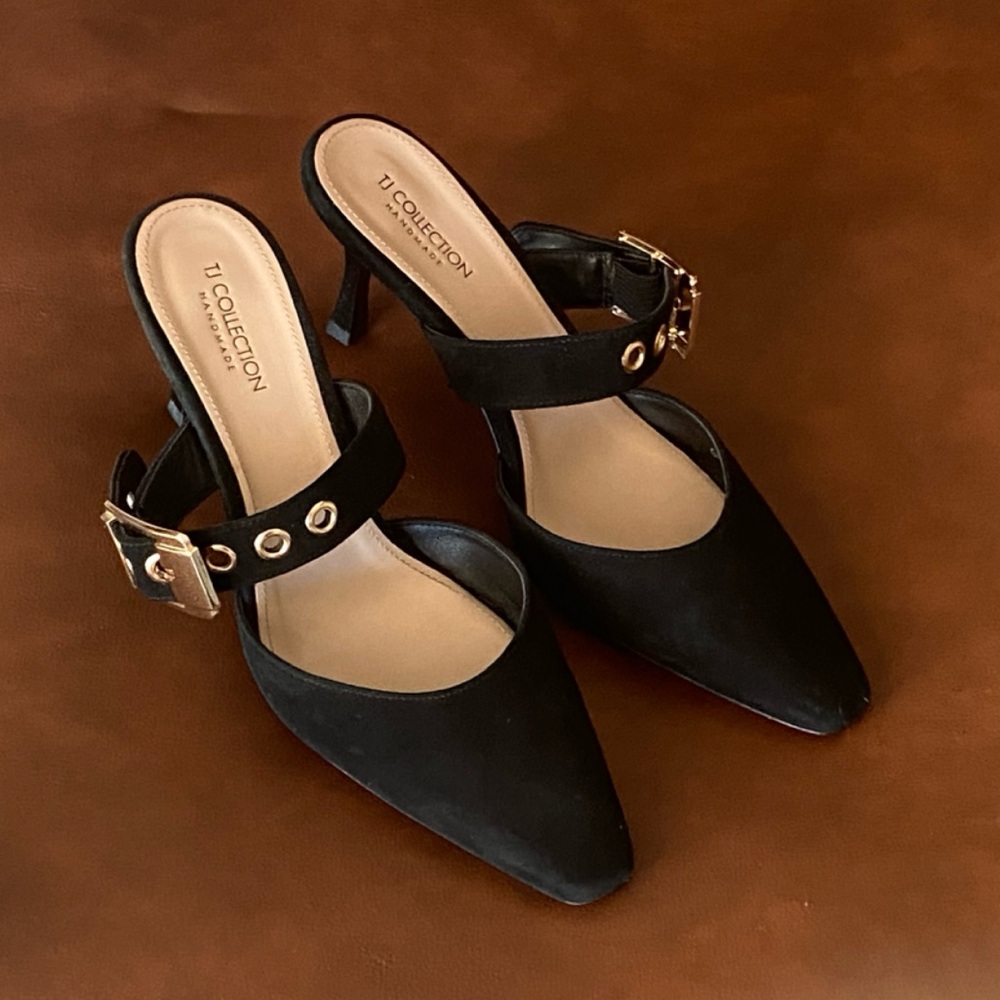 TJ Collection black suede mules with gold buckle detail